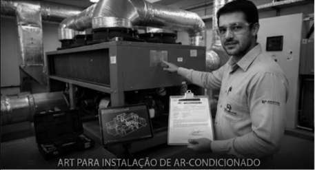 Engenheiro técnico emitindo ART para instalação de sistema de ar-condicionado em escritório comercial.